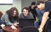 Students around a computer 